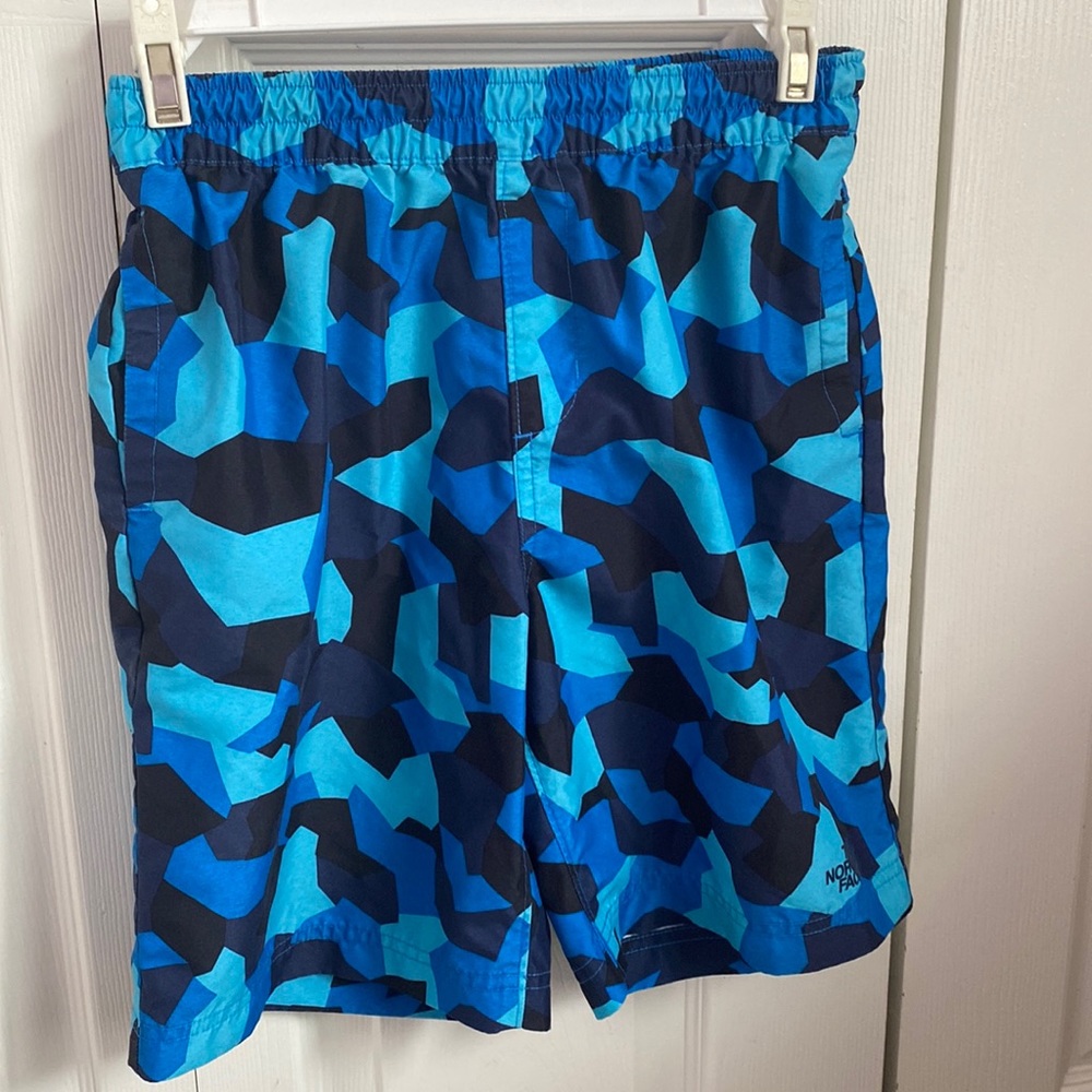 The North Face boys swimwear size L(14-16), multi blue in color